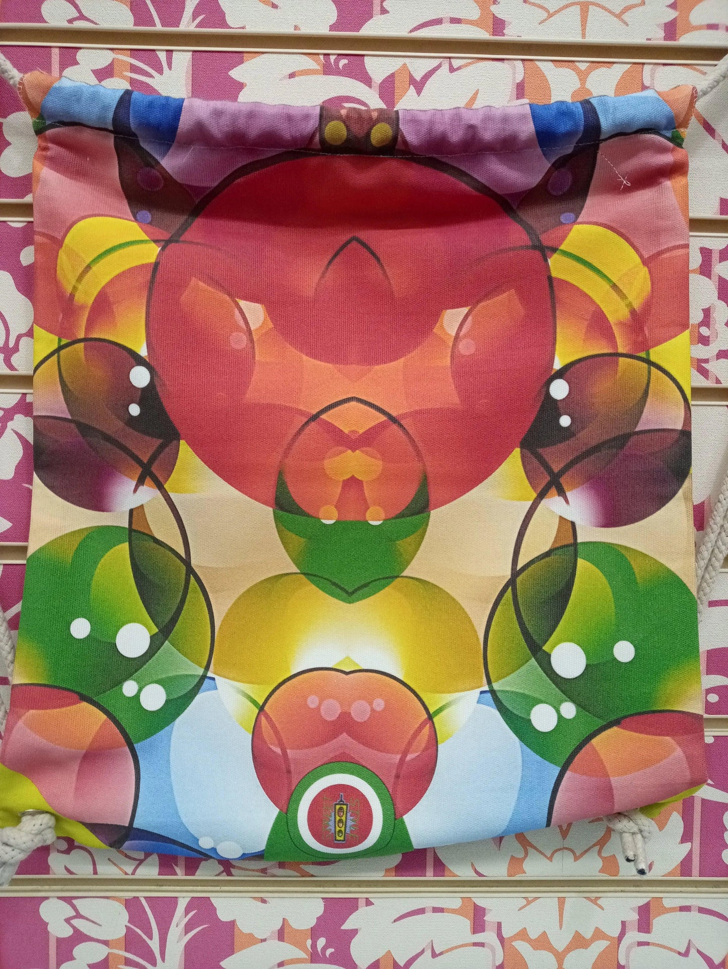 Zaino a sacca streetwear con fantasia astratta multicolore, tessuto canvas, stile urban