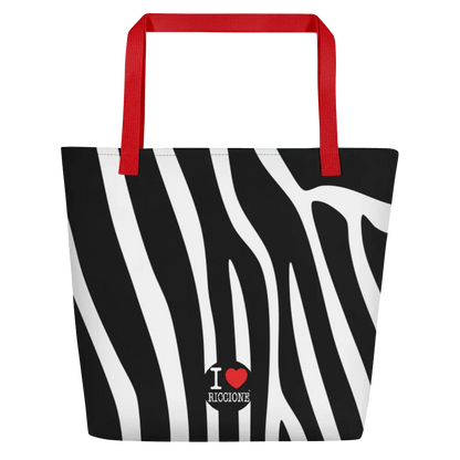 Borsa mare streetwear con fantasia zebrata bianca e nera, manici rossi, scritta I love Riccione.