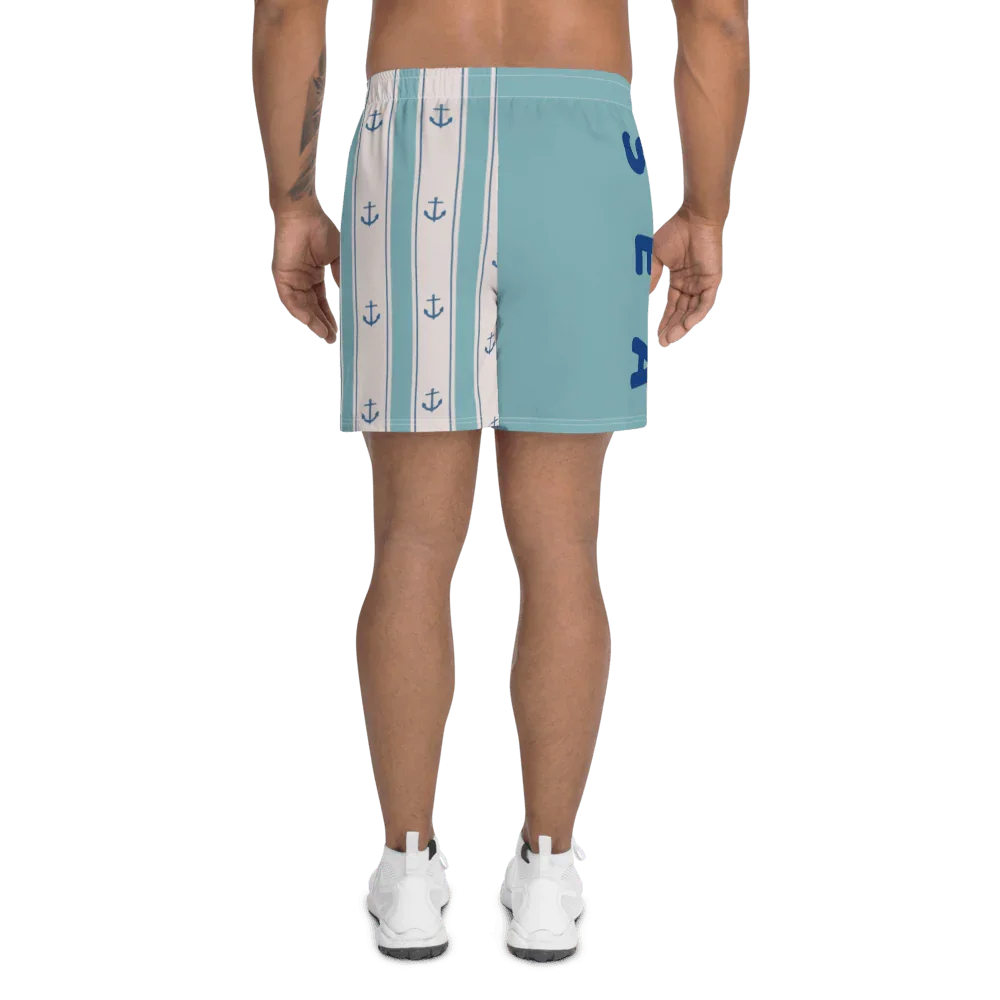 Shorts uomo streetwear azzurri con righe bianche e ancore blu, tessuto sportivo, stile urban.