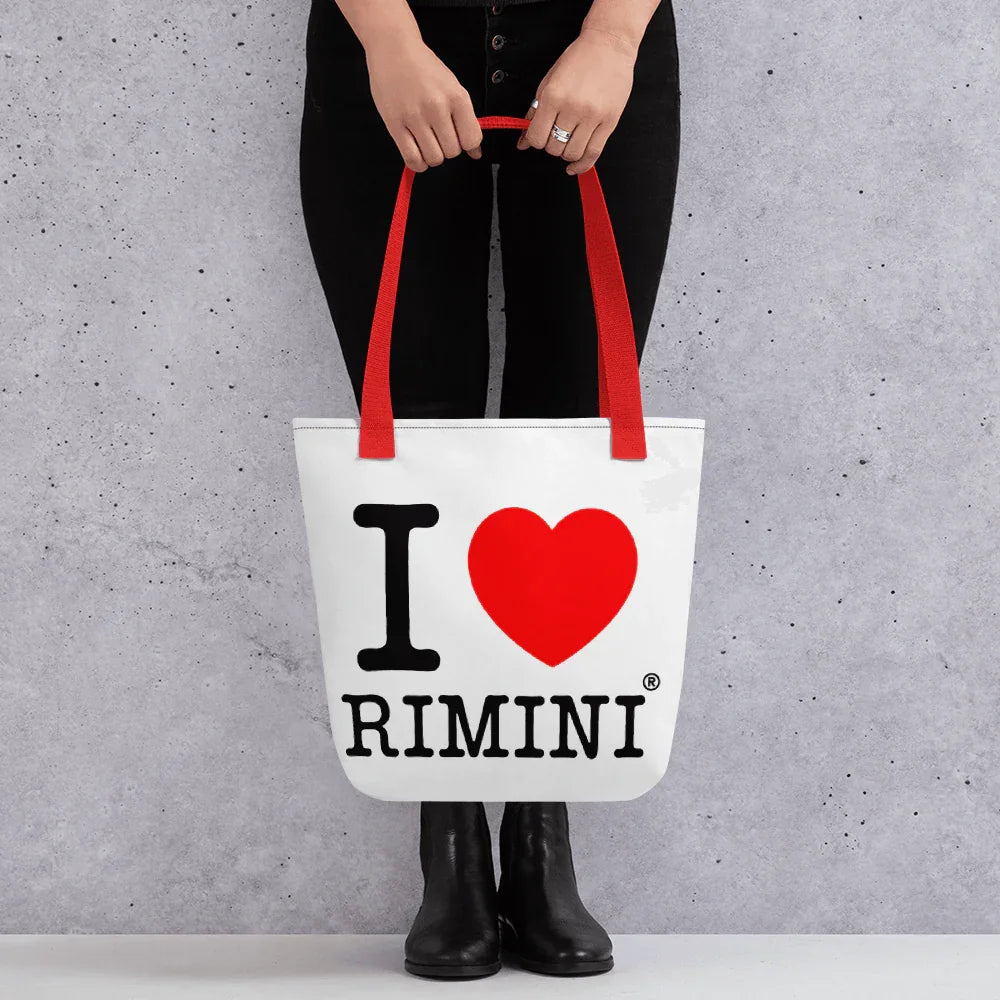 Shopper streetwear bianca in tessuto, stampa 'I love Rimini', manici rossi, stile urban.